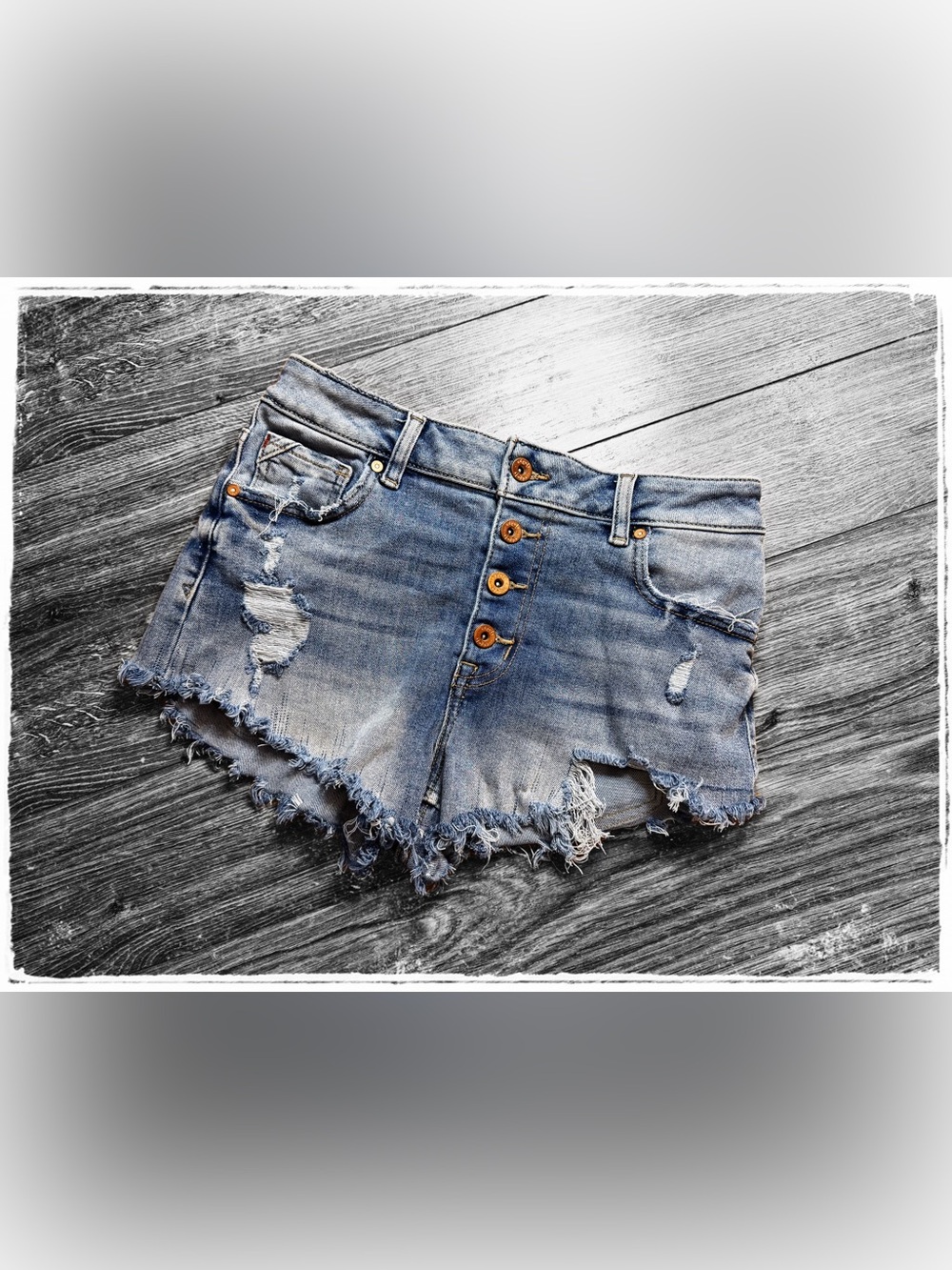 Button-Front Distressed Denim Cutoff Shorts in Light Blue